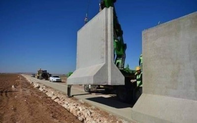 What is the truth behind the wall that is being built by Turkey to isolate Afrin?