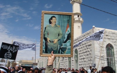 Did Iranian protestors raise Saddam Hussain photo?
