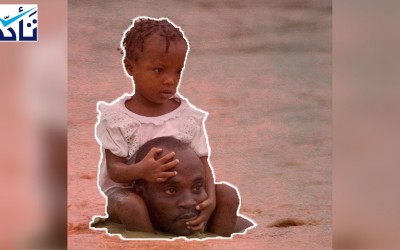 صورة الرجل الذي يحمل طفلة وسط الفيضانات ليست في السودان